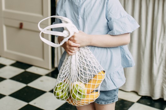 girl with an eco fruit bag